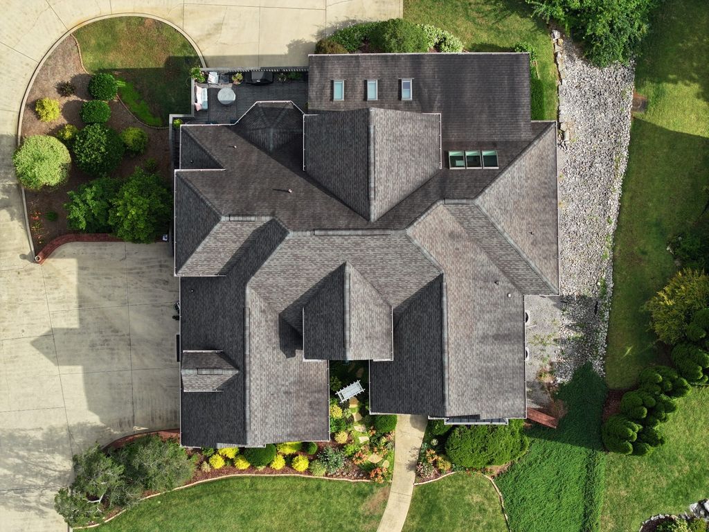 Overhead drone photograph used to document a complex multi-plane shingle roof during inspection